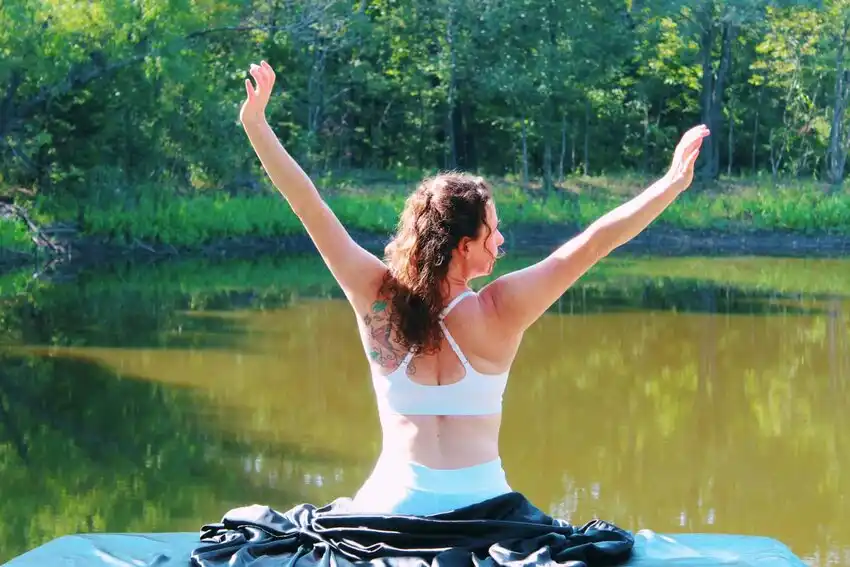 Massage therapist working on client in calming treatment room